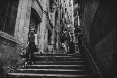 Low angle view of people walking on stairs