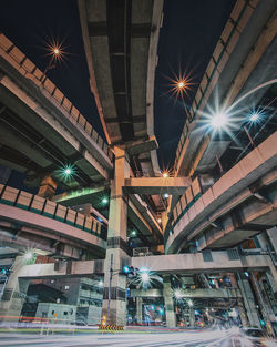 Low angle view of illuminated buildings at night