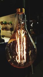Close-up of illuminated light bulb