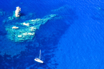 High angle view of people swimming in sea