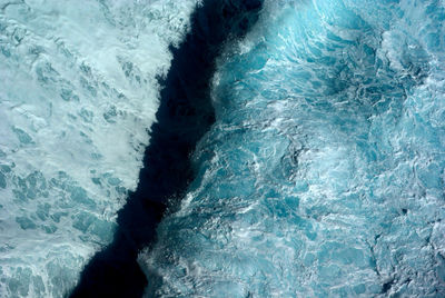 Aerial view of sea waves with shadow