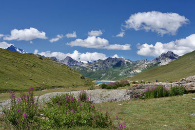 Scenic view of landscape and mountains against sky