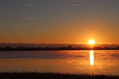 Scenic view of lake during sunset