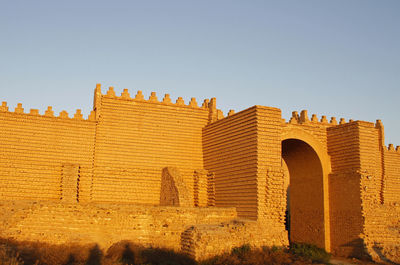 Low angle view of old building against clear sky