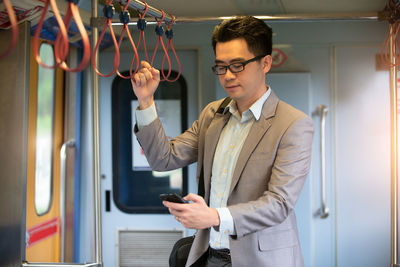 Young man using mobile phone