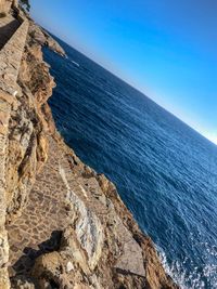 Scenic view of sea against clear blue sky