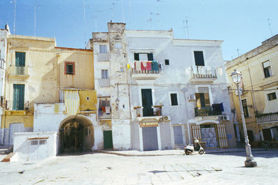 View of buildings in city against clear sky