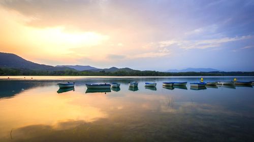 Scenic view of lake against sky during sunset