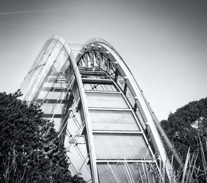 Low angle view of ferris wheel against sky