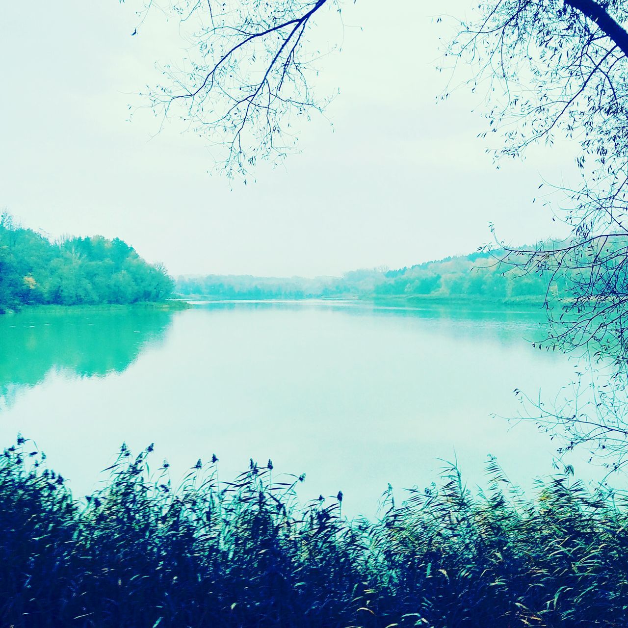 SCENIC VIEW OF LAKE WITH REFLECTION AGAINST SKY