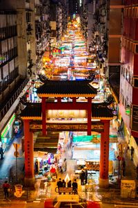 Group of people in illuminated building at night