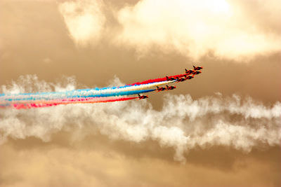 Airplane flying against sky