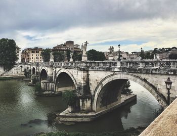 Arch bridge over river in town