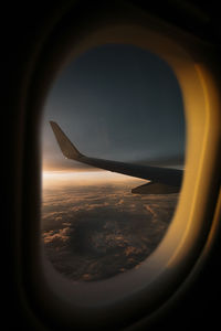 Aerial view of landscape seen through airplane window