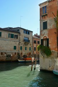 View of canal with buildings in background