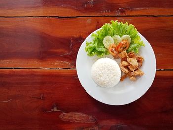 Close-up of rice with meat and vegetables on table