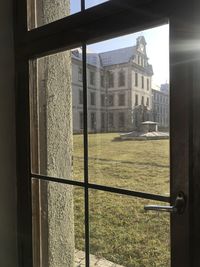 Buildings seen through glass window