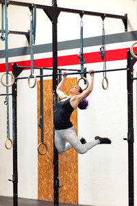 Young woman exercising at gym