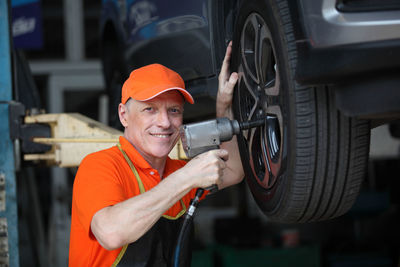 Portrait of man working at bus