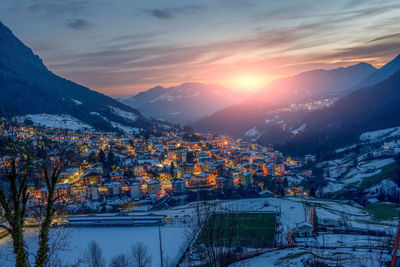 Aerial view of townscape against sky during sunset