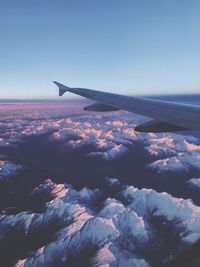 Aerial view of airplane flying in sky