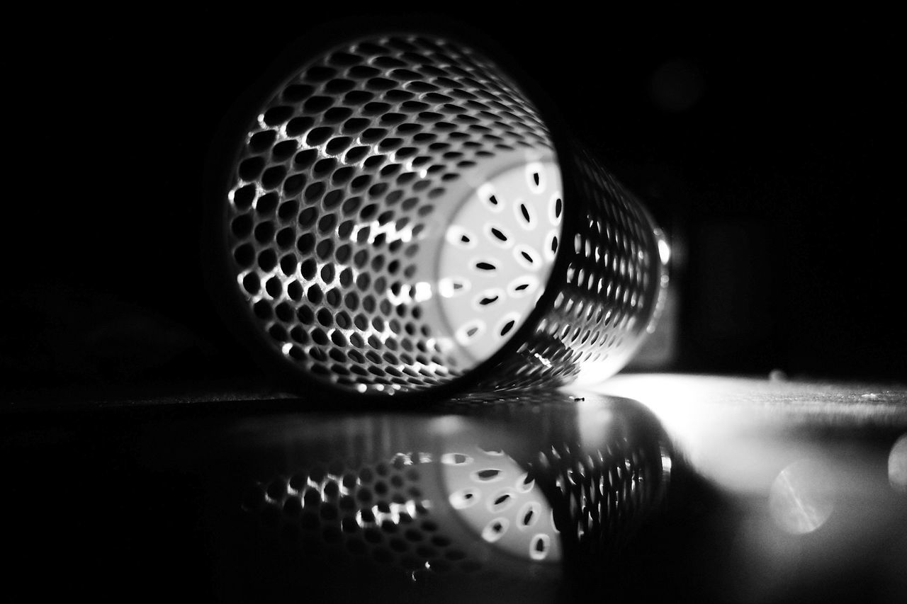 close-up, indoors, arts culture and entertainment, music, selective focus, metal, pattern, reflection, no people, still life, technology, microphone, table, nightclub, circle, input device, single object, geometric shape, shape, nightlife, black background, silver colored, clubbing