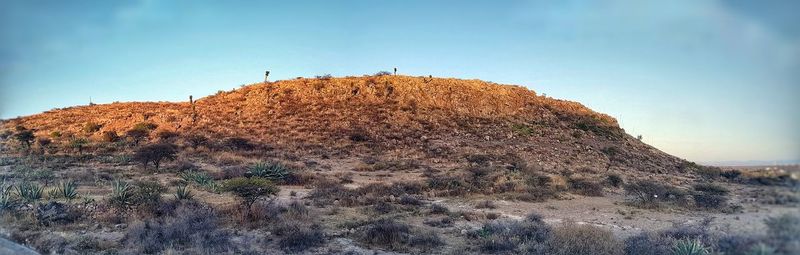 Low angle view of rock formation against clear sky