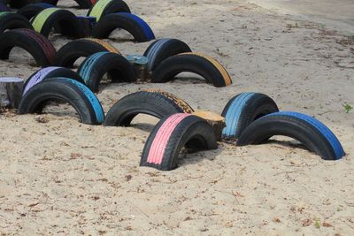 Close-up of seats in row on sand