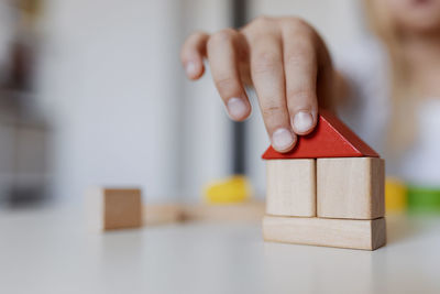 Close-up of hand playing with toy