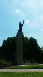 Low angle view of statue against sky