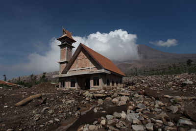 Castle on mountain against sky