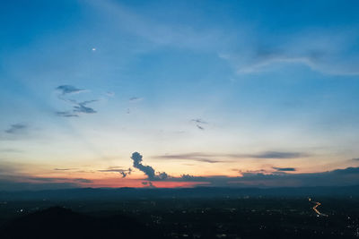 Scenic view of sunset over city