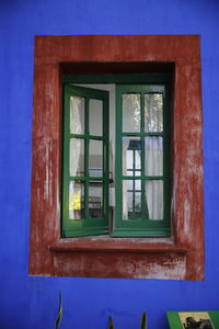 Low angle view of window on old building