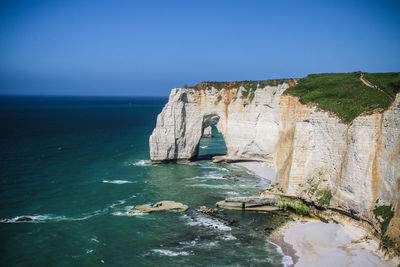 Scenic view of sea against clear blue sky