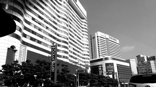 Low angle view of skyscrapers against clear sky