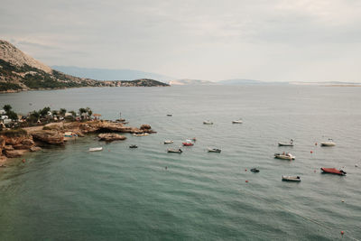 High angle view of boats in sea against sky