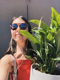 Portrait of young woman wearing sunglasses