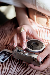 Midsection of woman using mobile phone