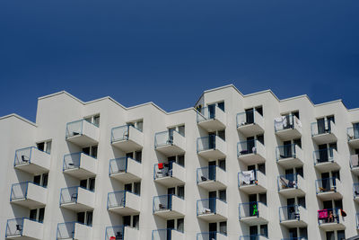 Low angle view of building against clear blue sky