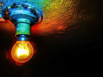 Close-up of illuminated light bulb