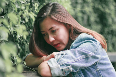 Portrait of beautiful young woman looking away