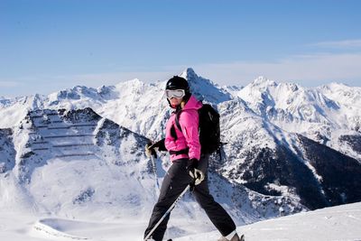 Full length of woman on snow against mountain