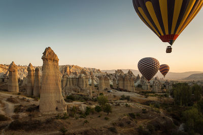 Low angle view of hot air balloon over city