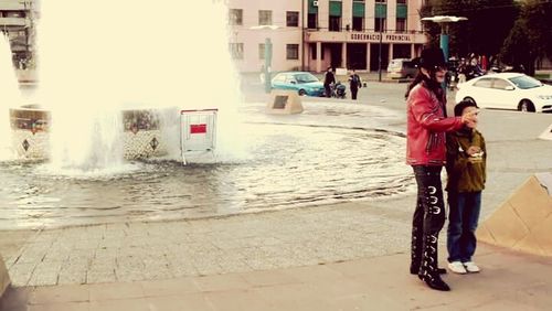 Woman walking on city street