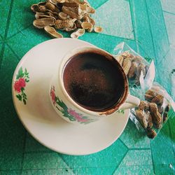 High angle view of coffee cup on table