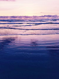 Scenic view of sea against sky at sunset