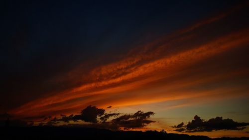 Low angle view of dramatic sky during sunset