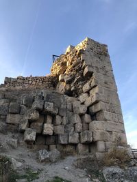 Low angle view of old ruin building against sky