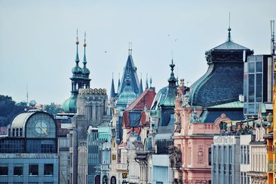 Buildings in city against sky