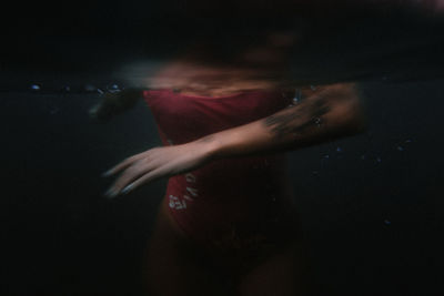 Blurred motion of woman hand in water